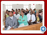 Principal Michael Culmer, Eleu. District Superintendent Mrs. Helen Simmons-Johnson, Mr. Kirkwood Cleare, and Mrs. Francis Friend are seated in the front row with teachers of the NEHS in the other pews fully engaged as the guest speaker addresses the 2016 students - -490A3379