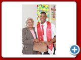Honour Roll student Philip Moss (Deputy Head Boy) of the NEHS Class of 2016 being presented with a gift by Evangelist Shirley Burrows - 490A3396