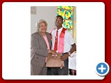 Honour Roll student, Obincent Cineus,(Senior Prefect) of the NEHS Class of 2016 being presented with a gift by Evangelist Shirley Burrows -490A3397