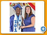 Valedictorian of the WHS Class of 2016, Naaman Rolle, receiving an award in Mathematics from teacher Ms. Parks - 490A3268